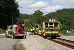 464 - Maintenance of Way machines line up prior to heading to their train to be loaded to move to another location.